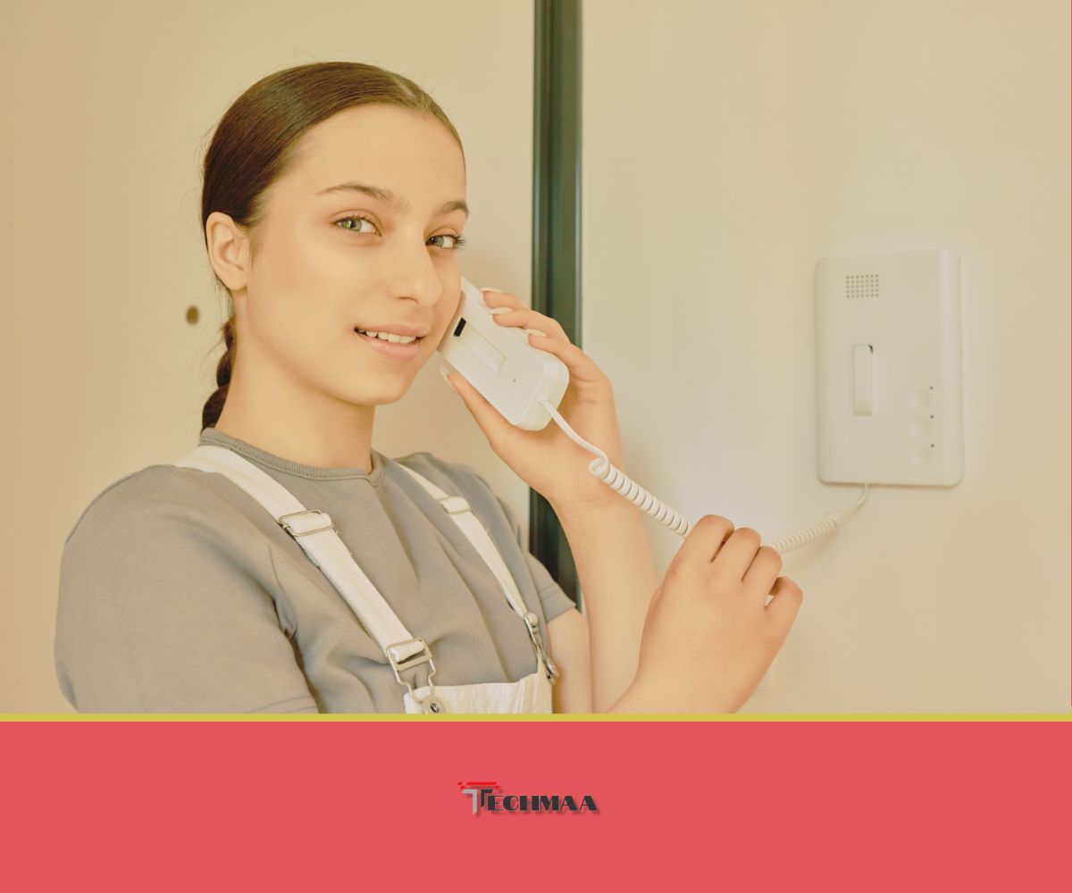 A female employee using an IP telephone to answer a customer query, ensuring seamless business communication.